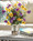 Pansy Perfect Faux Flower Arrangement arranged with pebbles in a pint mason jar of clear acrylic water. Available at Petals.