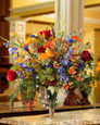 25" glorious garden silk flower centerpiece arranged in glass vase